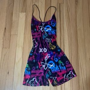 Tight fit graffiti romper//Never worn//Open back